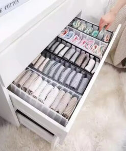 Clothes organiser with multiple compartments for neatly storing underwear, socks, bras, and scarves in drawers.